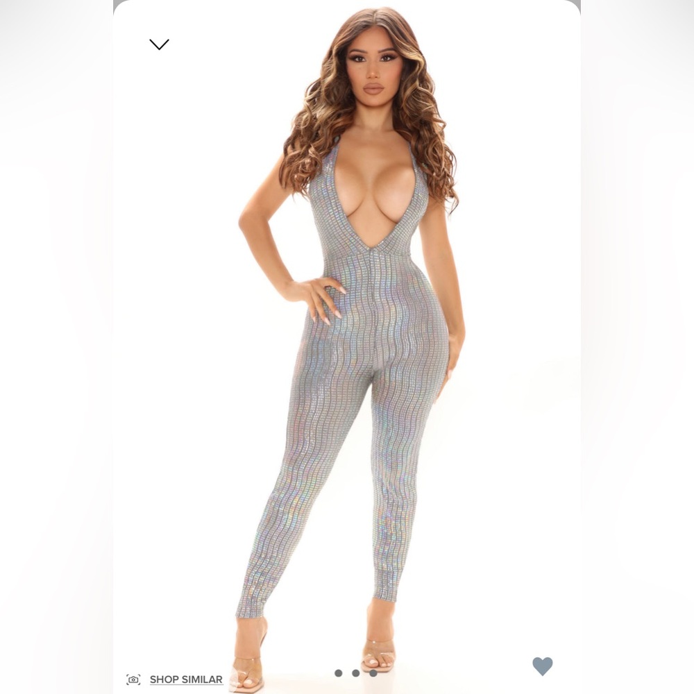 Silver sequins jumpsuit . Size XS. Brand new with tags!!